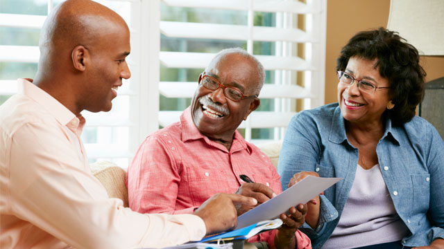 Couple receiving insurance quote from their agent